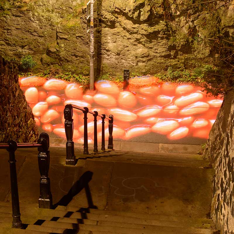 Light painting of giant Baked Beans flowing along a path in Edinburgh. Pete Brittain and Iain Robinson 2013